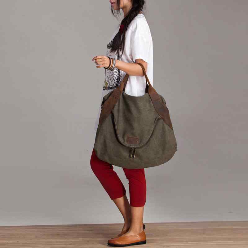 Woman with a large olive canvas bag.