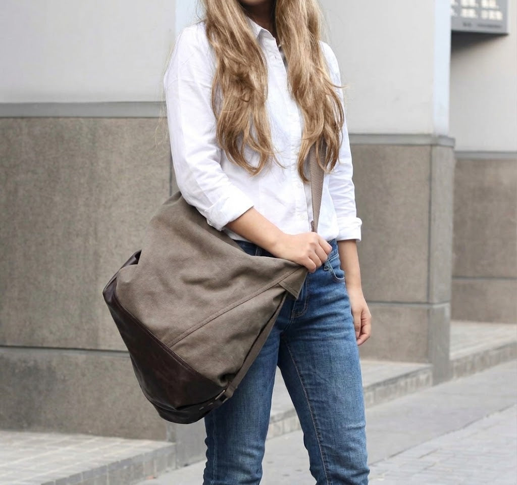 Spacious women's shoulder bag in a sack style for everyday wear, worn crossbody