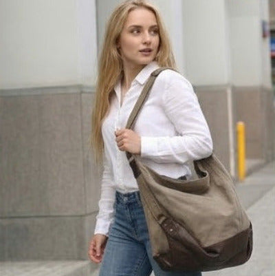 Girl walking down the street with a women's SAFFI HOBO bucket bag made of thick canvas fabric. The bag is perfect for everyday use.