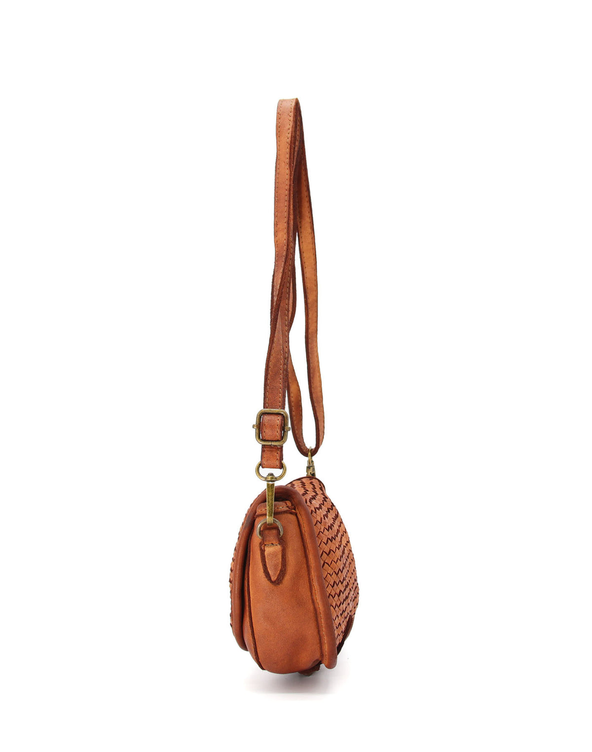 Bok małej skórzanej torebki damskiej z  odpinanym, regulowanym paskiem. Torebkę można nosić na ramieniu, crossbody lub w dłoni po odpięciu paska.	